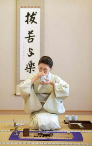 Woman smelling incense