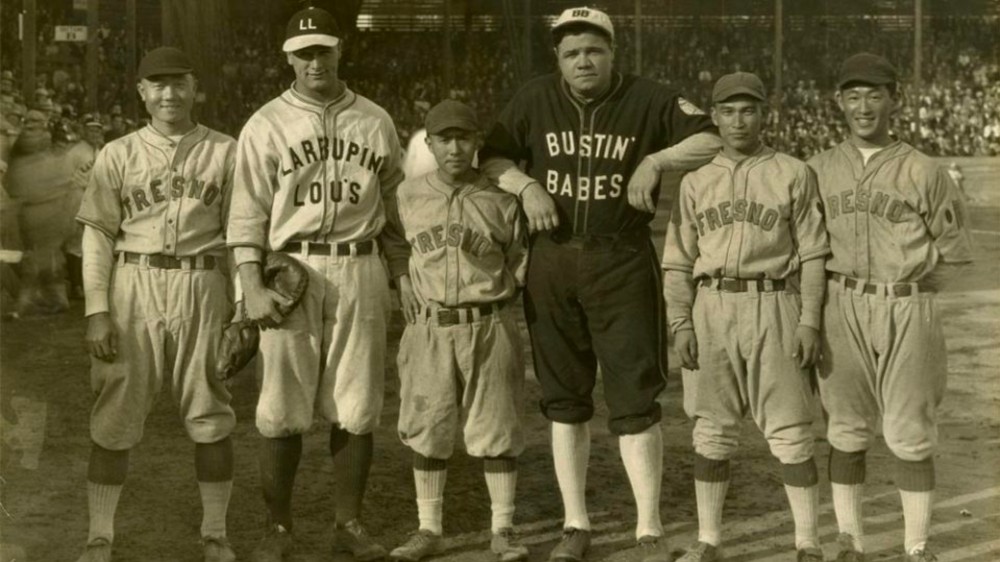 Legends Lou Gehrig & Babe Ruth with four members of the Fresno team.