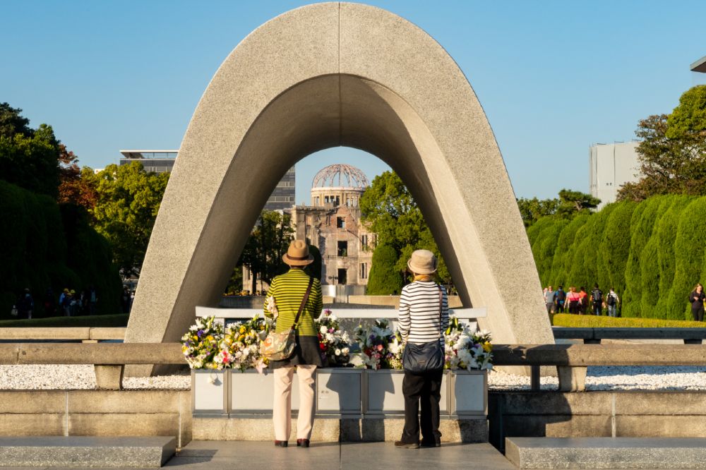 The atomic
        dome in Hiroshima is framed by the Peace Memorial